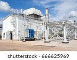Small photo of Gas-turbine plant. Industrial park. Piping system. white building power plant