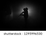 silhouette of man with assault... | Shutterstock . vector #1295996530