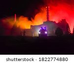 Creative artwork decoration. Chernobyl nuclear power plant at night. Layout of Chernobyl station during nuclear reactor explosion. Fire fighters at work. Selective focus
