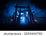 Creative artwork decoration. Abstract Japanese style wooden tunnel at night. Night scene in fantasy forest. Selective focus