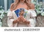 Small photo of Tarot card in hands. White magic, attributes for witch, magic for love, health, attracting happiness . Esoteric concept. Europe, Ukraine. Kiev July 27: Illustrative Editorial