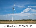 Small photo of Wind Mill India.View of wind farm or wind park, with high wind turbines for generation electricity.Gomangalampudur, Pollachi, Tamil Nadu India