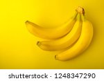 sweet bananas on the yellow... | Shutterstock . vector #1248347290