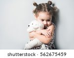 Cute little girl huggin toy...