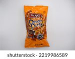 Small photo of Kongsvinger, Norway 30 october 2022: Herr's Baked Cheese curls cheese puffs package chips crisps snacks savory food import from US America