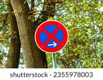 German traffic sign: Forbidden to cross, parking to the right is prohibited.