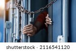 Small photo of Woman trapped in cargo container ,woman immure by chain wait for Human Trafficking or foreign workers, Woman holding master key wait for holp help Refugee