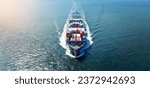 Small photo of front view Cargo Container ship with contrail in the ocean ship carrying container and running for import export concept technology freight shipping by ship.