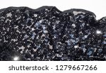 Small photo of Fabric texture, background, black sequined.tinsel, trumpery, frippery, gaud, gewgaw, gimcrack