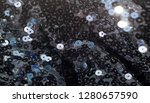 Small photo of Fabric texture, background, black sequined.tinsel, trumpery, frippery, gaud, gewgaw, gimcrack