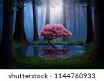 Pink tree and pond in the forest at night. Photomanipulation.