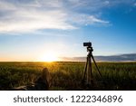 Small photo of preparing to shoot the sun going beyond the horizon