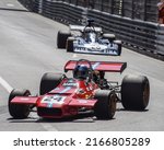 Small photo of Principality of Monaco - May 13, 2022: Vintage Formula 1 race cars make the downhill turn toward the infamous "Hairpin" turn at the 2022 Monaco Historic Grand Prix.