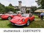 Small photo of Como, Italy - May 22, 2022: A 1971 Ferrari Dino 246 GT, front and center at the Villa Erba during Wheels a Weisswurscht, a companion event to the 2022 Concorso d'Eleganza Villa d'Este on Lake Como.