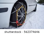 Tyre with chains, car in winter season on snow