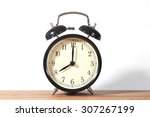 Small photo of It's eight o'clock already. Time to wake up and hurry. An image of a retro clock showing 08:00 am or pm.