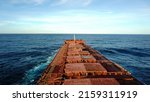 Small photo of Cape sized bulk carrier, cargo ship's main deck and it's forecastle. Fair weather and good visibility.