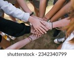 Small photo of Team of children put hands together.Peaceful Protest kids group and protester unity in a fist of diverse people connected together as a nonviolent resistance symbol of justice and fighting