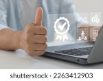 Small photo of Businessman showing raised thumbs with certificate icon. Certification and standardization process, iso certified business, conformity to international standards and quality assurance warranty concept