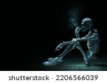 Human skeleton death smoking cigarette