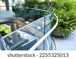 Small photo of Curve tempered laminated glass railing balustrade panels frame less ,safety glass for modern architecture and interior. Concept for Aluminum balcony or terrace design with glazing profile.
