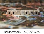 Small photo of stipend - cube with letters, sign with wooden cubes