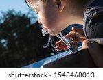 Little girl drink water from...