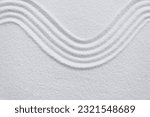 Zen garden with line pattern on white sand in Japanese style, Sand texture surface with wave parallel lines pattern,Background  banner for Harmony,Meditation,Zen like concept