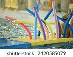 Small photo of Colorful wacky Noodles in swimming Pool Toys Foam Stick, Swimming Pool Noodles.