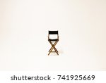 Directors chair isolated on a white background. Space for text.
Vacant chair. The concept of selection and casting.