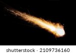 Small photo of A meteorite flies at high speed, leaving a fiery trail in the atmosphere.