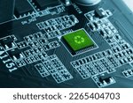 Small photo of Concept of green technology. green recycle sign on circuit board technology innovations. Environment Green Technology Computer Chip.Green Computing, Technology, CSR, and IT ethics