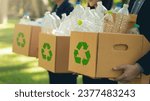 Small photo of CSR corporate social responsibility. Business people holding box garbage for recycling. Earth Day, Business teamwork to recycle for environmental sustainability. volunteer, Unity. team business.