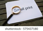 Small photo of Look close with Magnifying glass on small print