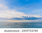 A view of sea with blue clouds...
