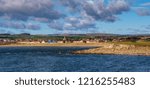 Small photo of From Ardeen shoreline over to the town of Stevenston on the North Ayrshire coast of Scotland on a october breezy day.