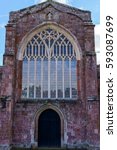 Small photo of Crediton Parish Church of the Holy Cross and the Mother of Him Who Hung thereon as seen from back entrance with stained glass, Devon, UK, March 4, 2017
