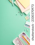 Small photo of Brighten up your school routine with vibrant arrangement. Girlish stationery spread out on teal surface from vertical top view, featuring planners, pencil case, sticky notes, pins. Add own text or ad