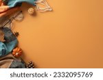 Small photo of Above view of a warm and cozy autumn ambiance at home. Glasses, patchy scarf, pumpkin candles, maple foliage and aromatic chinese anise create a perfect brown backdrop for text or advert placement