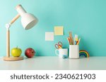 Empower students with an organized study zone through this side-view picture featuring white desk with lively school supplies in penholder and lamp on a blue backdrop, suitable for text or ad usage