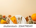 Above view captures essence of family Thanksgiving dinner with gilded tableware, classic cutlery, and autumnal decorations rest on a beige isolated background, inviting text or promotional content