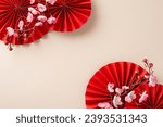 Small photo of Get into the celebratory mood with this enchanting Chinese New Year setup. Overhead shot of red fans, festive symbols, traditional asian tree against a pastel beige backdrop