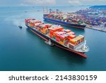 Small photo of Arial view by drone camera transportation logistics and container dock cargo yard with working crane bridge in shipyard with transport logistic import export with blue sky background.