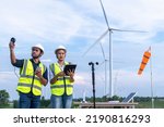 Small photo of Engineers using meteorological and drone instrument collect data laptop to measure the wind speed, temperature,humidity and solar cell system on wind turbine station is sustainable energy concept.