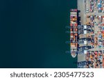 Small photo of Ariel view transportation logistics and container dock cargo yard with cargo shipment working crane bridge in shipyard with transport logistic import export with twilight sky background.