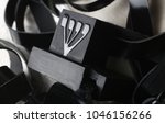 Small photo of Tefillin -[Jewish phylactery] with black straps on a with blackground