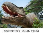 Small photo of Dinosaur's mouth had sharp teeth . Carcharodontosaurus dinosaur, featured ,dinosaurs statue that showing at "Dinosaur Park".