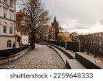 Old european cobblestone embankment over Vltava river. Cozy empty cityscape. . High quality photo