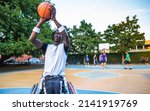 Small photo of Basketball player having training in his wheelchair - Determination and fortitude concept