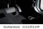 Small photo of Accelerate and Brake. Foot pressing foot pedal of a car to drive ahead. Accelerator and brake pedal in a car. Driver driving the car by pushing accelerator pedals of the car. inside vehicle automobile